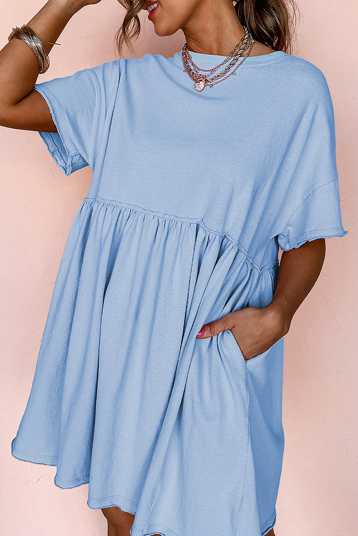 Robe babydoll bleu ciel unie à poches et bords bruts