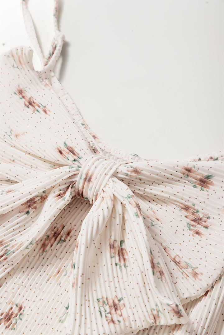 Débardeur blanc à bretelles spaghetti et gros nœud dans le dos, motif floral plissé