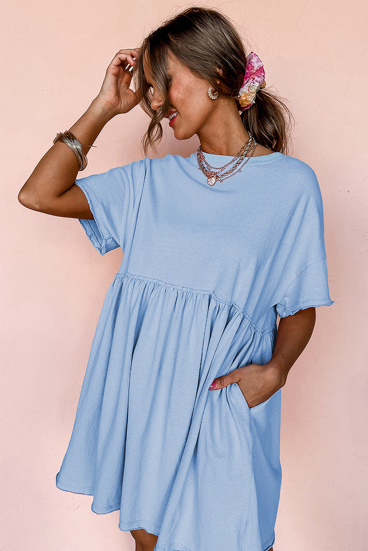 Robe babydoll bleu ciel unie à poches et bords bruts