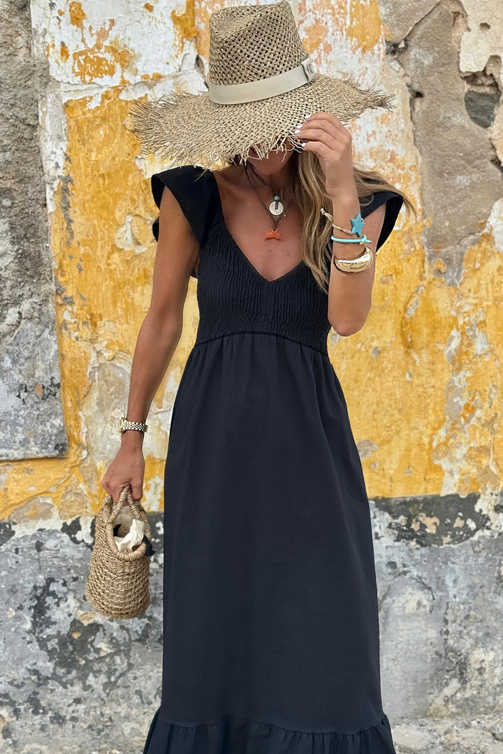 Robe longue noire à volants, col en V, manches flottantes, corsage froncé, taille haute