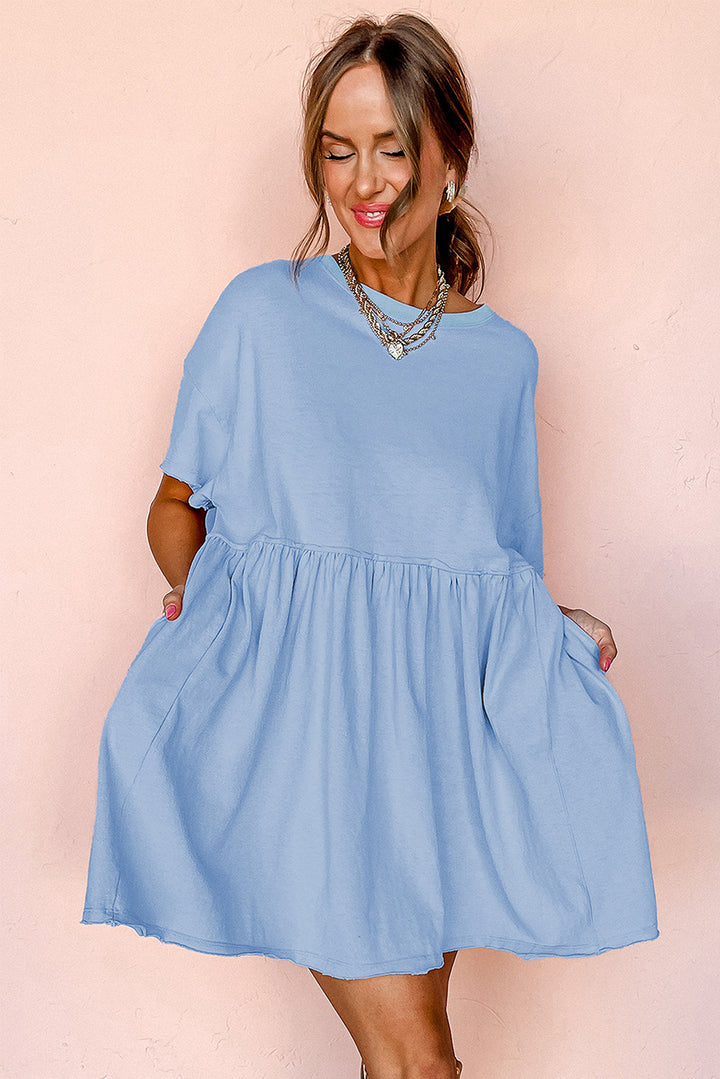 Robe babydoll bleu ciel unie à poches et bords bruts