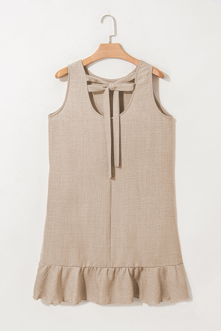Robe courte sans manches gris fumé à dos échancré et ourlet à volants