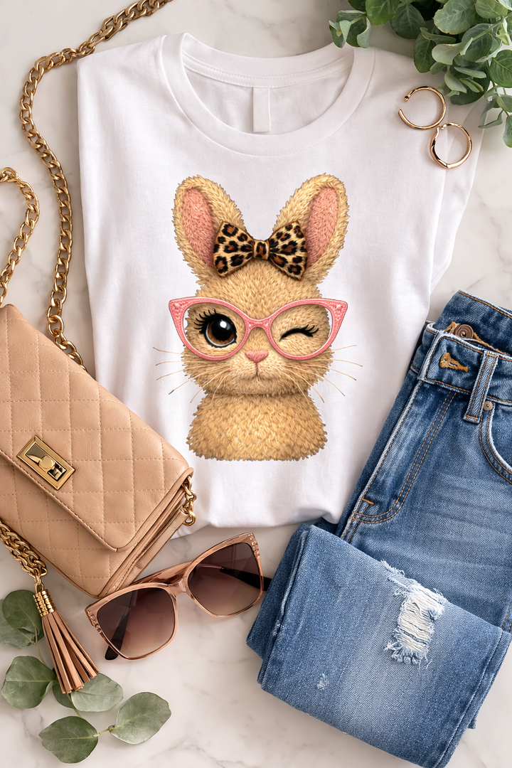 Winking Bunny Graphic Tee — Cute Bunny with Leopard Bow & Pink Glasses