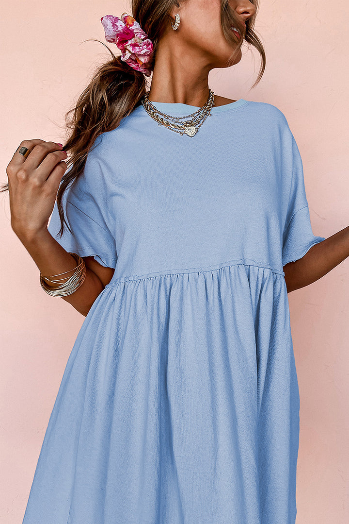 Robe babydoll bleu ciel unie à poches et bords bruts