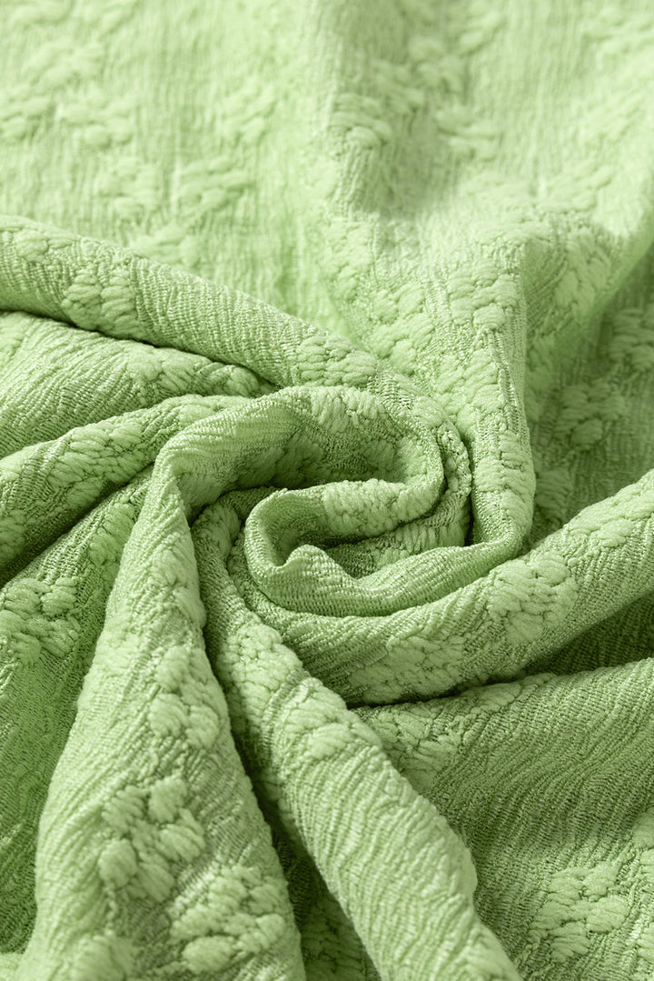 Chemisier ras du cou texturé vert clair uni à fentes latérales