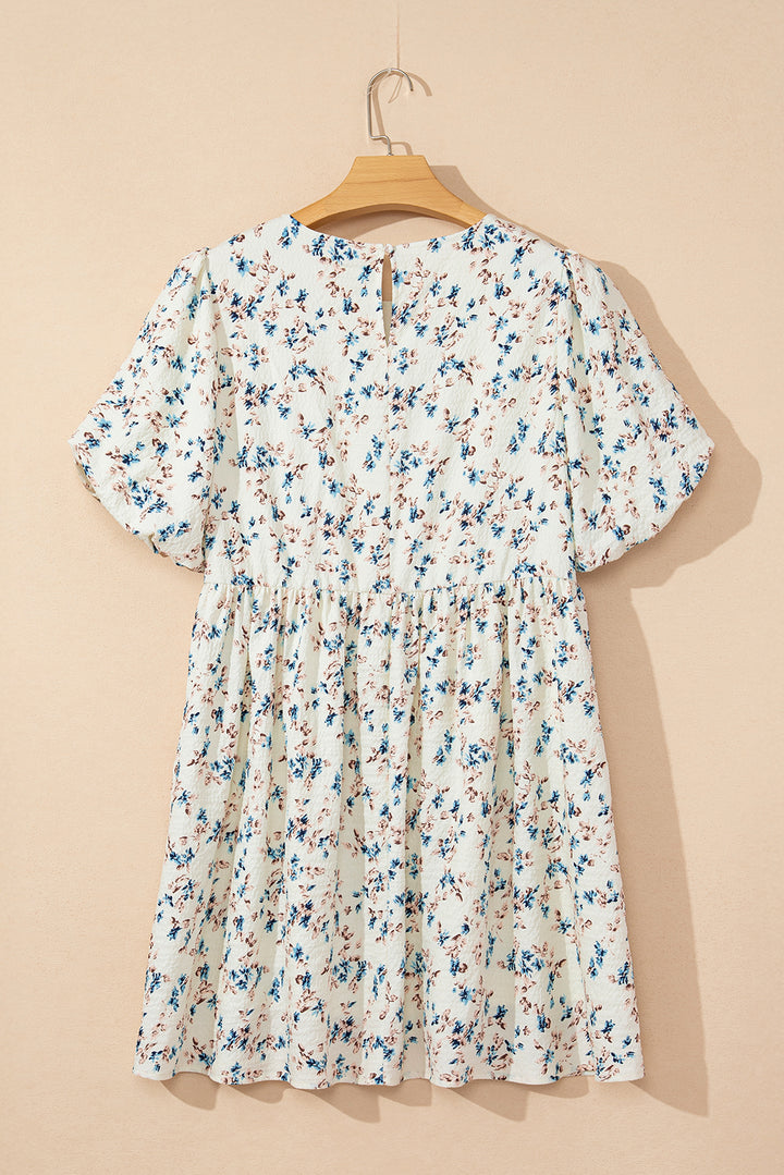 Mini-robe taille empire beige à manches courtes bouffantes et à fleurs