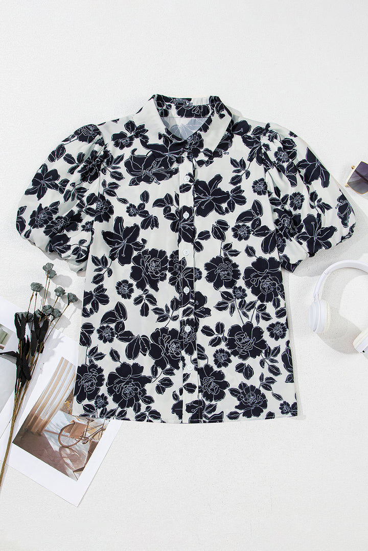 Chemise décontractée noire à manches bouffantes et motif floral