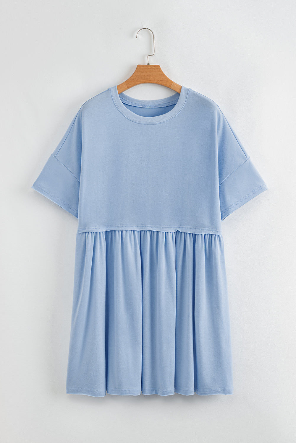 Robe babydoll bleu ciel unie à poches et bords bruts