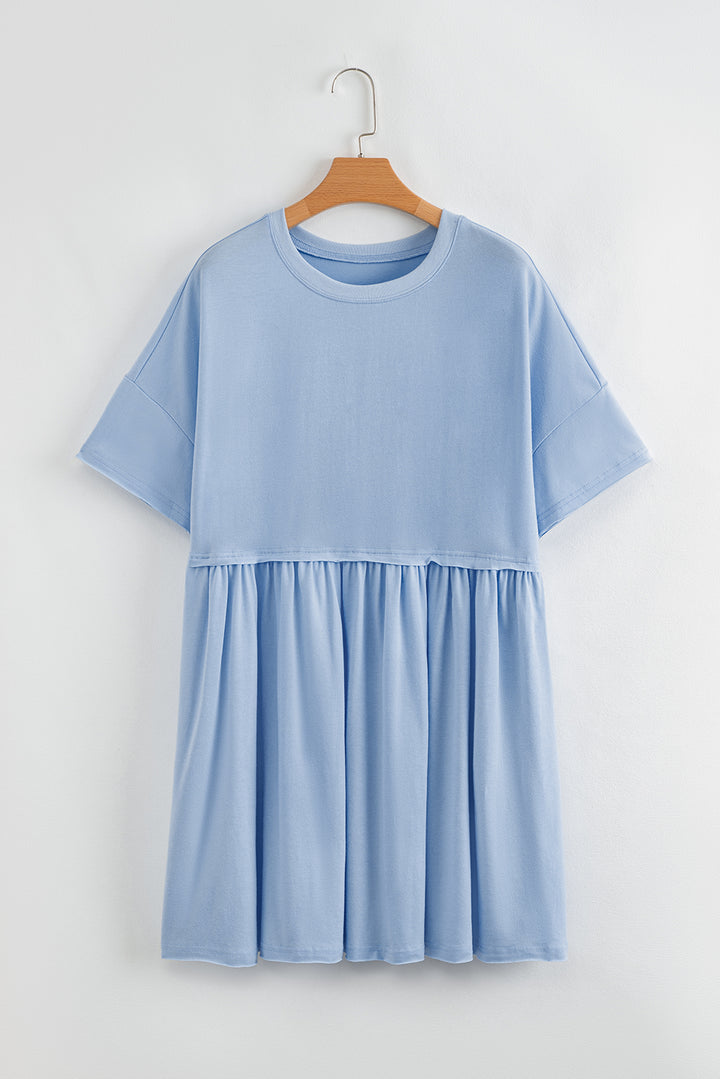 Robe babydoll bleu ciel unie à poches et bords bruts