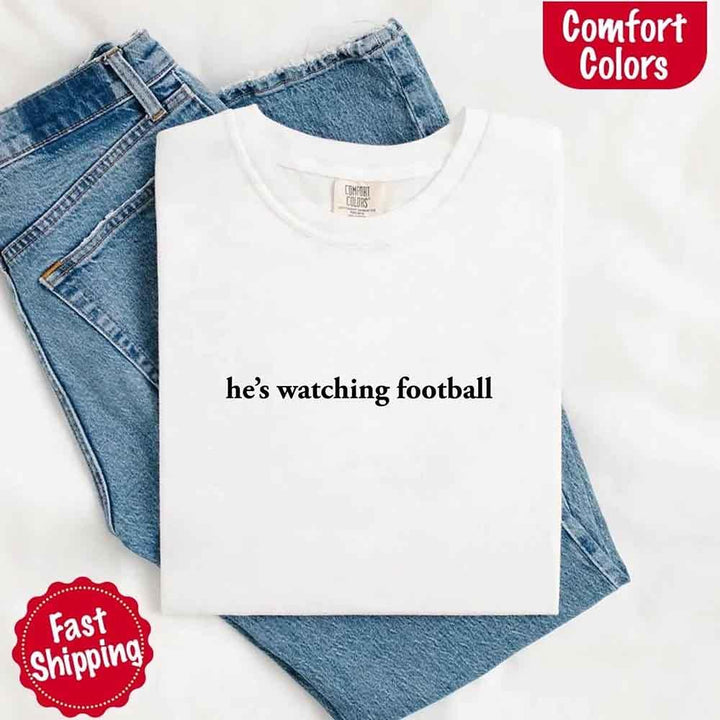 He’s Watching Football Tee - Comfort Colors Funny Shirt for Her
