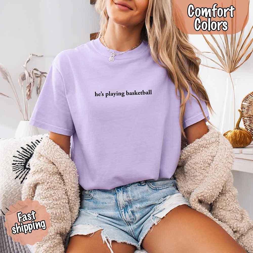 He’s Playing Basketball – Funny Sports Girlfriend Comfort Color Shirt for Women