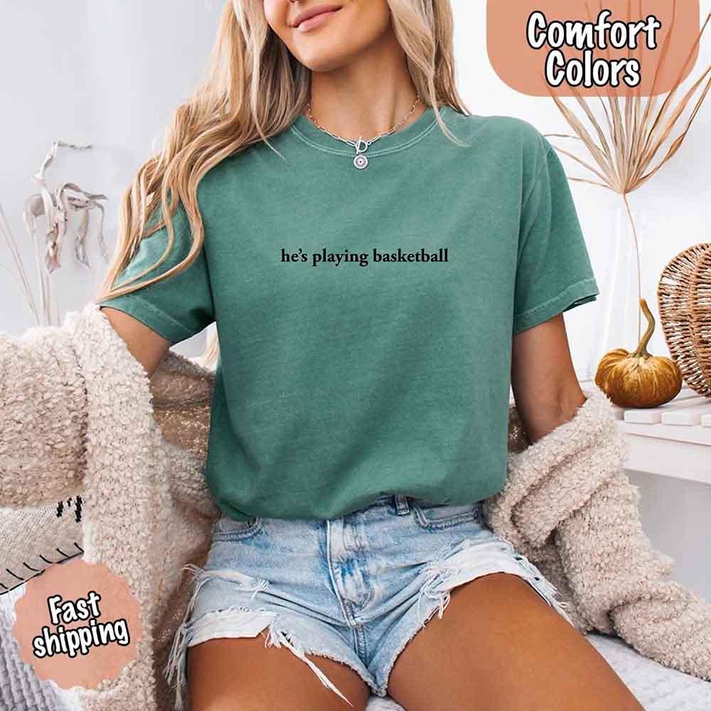 He’s Playing Basketball – Funny Sports Girlfriend Comfort Color Shirt for Women