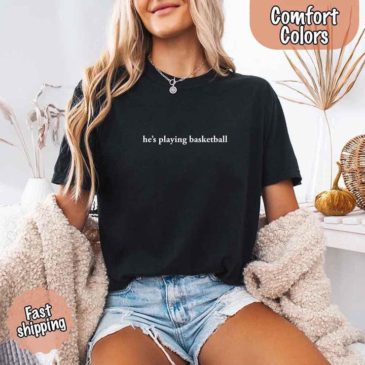 He’s Playing Basketball – Funny Sports Girlfriend Comfort Color Shirt for Women