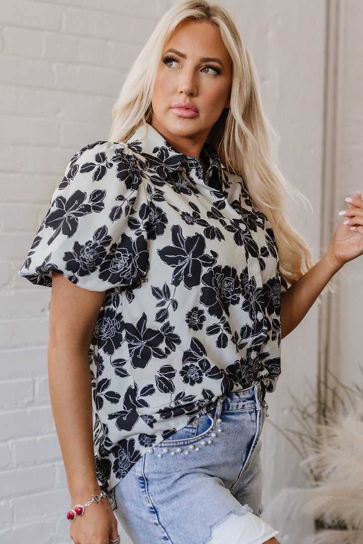 Chemise décontractée noire à manches bouffantes et motif floral