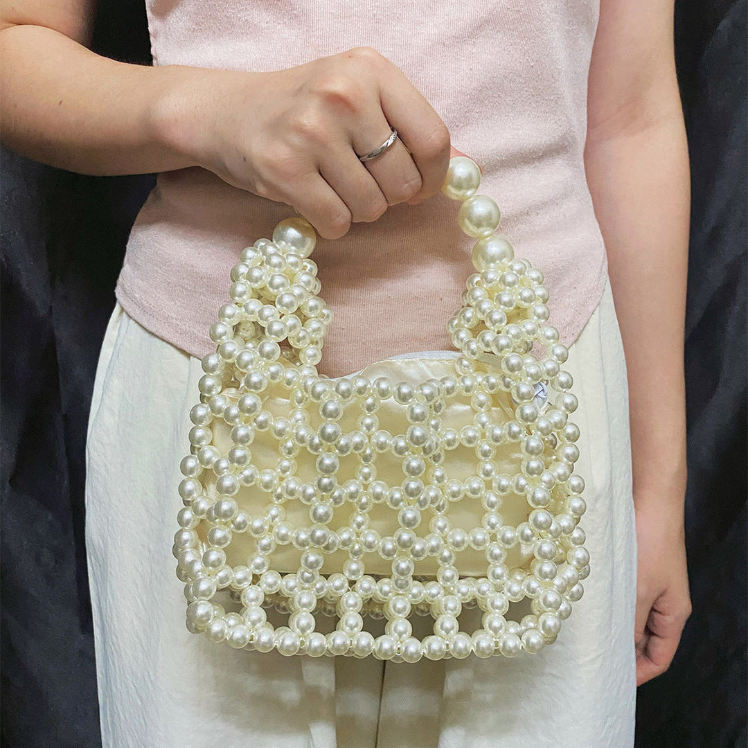 High Sense Minority Simple Elegant Hollow Out Cutout Handmade Beaded Dumpling Bag Retro Woven Handbag