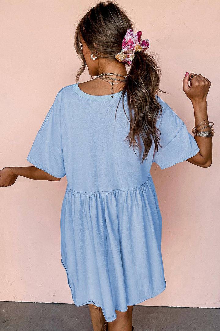 Robe babydoll bleu ciel unie à poches et bords bruts