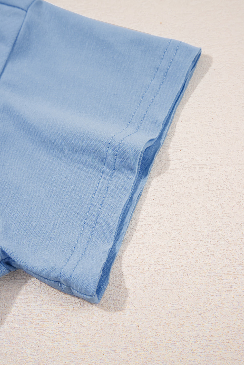 Robe babydoll bleu ciel unie à poches et bords bruts