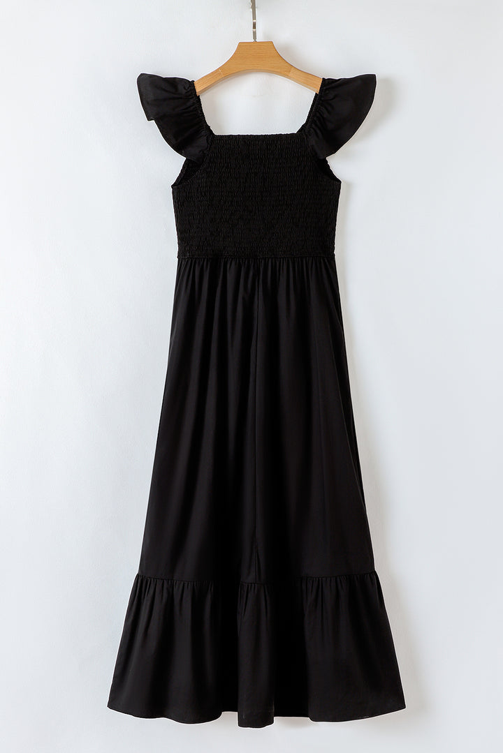Robe longue noire à volants, col en V, manches flottantes, corsage froncé, taille haute
