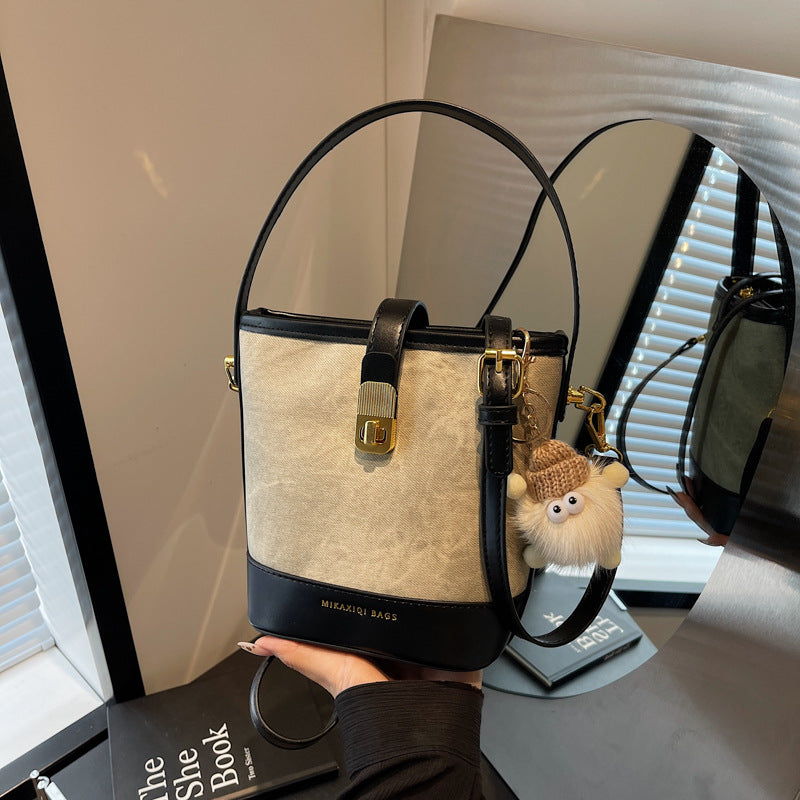 Vintage Bucket Crossbody Bag with Plush Charm