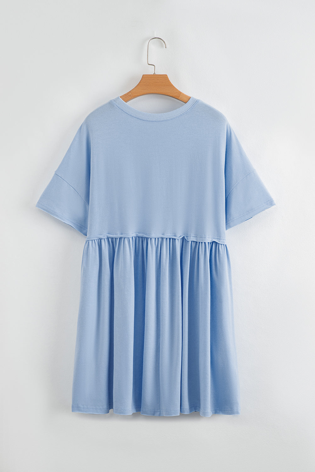Robe babydoll bleu ciel unie à poches et bords bruts