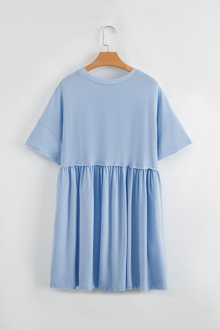 Robe babydoll bleu ciel unie à poches et bords bruts