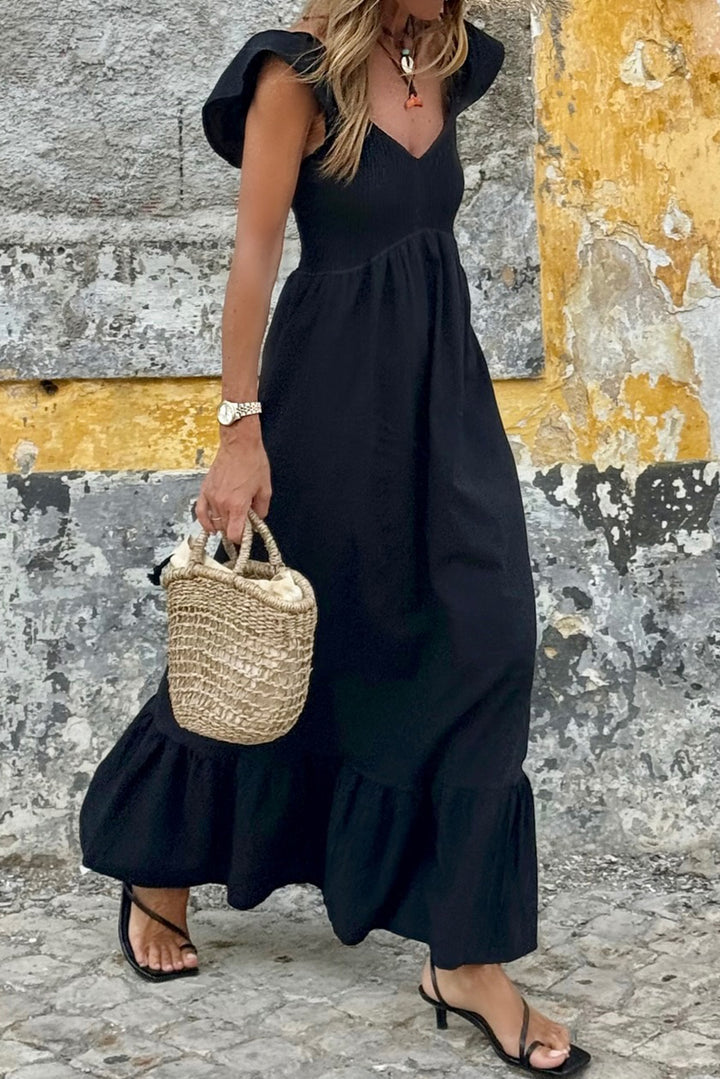 Robe longue noire à volants, col en V, manches flottantes, corsage froncé, taille haute