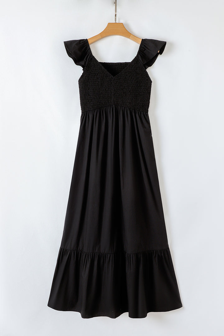 Robe longue noire à volants, col en V, manches flottantes, corsage froncé, taille haute