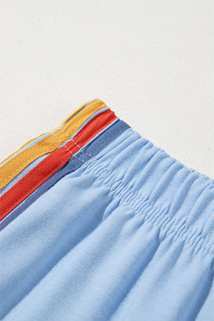 Pantalon de survêtement taille haute bleu clair à motif arc-en-ciel