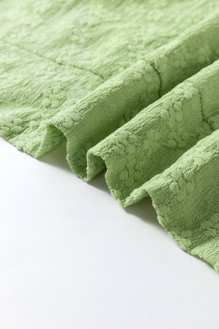 Chemisier ras du cou texturé vert clair uni à fentes latérales