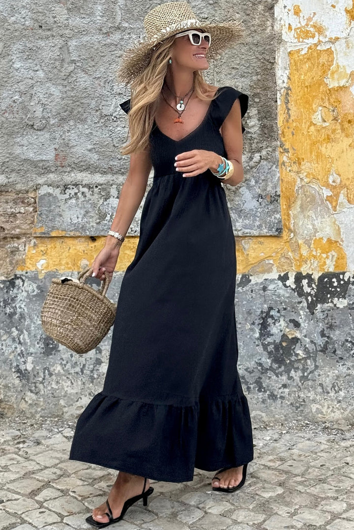 Robe longue noire à volants, col en V, manches flottantes, corsage froncé, taille haute