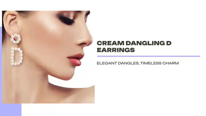 Cream Dangling D Earrings by@Outfy